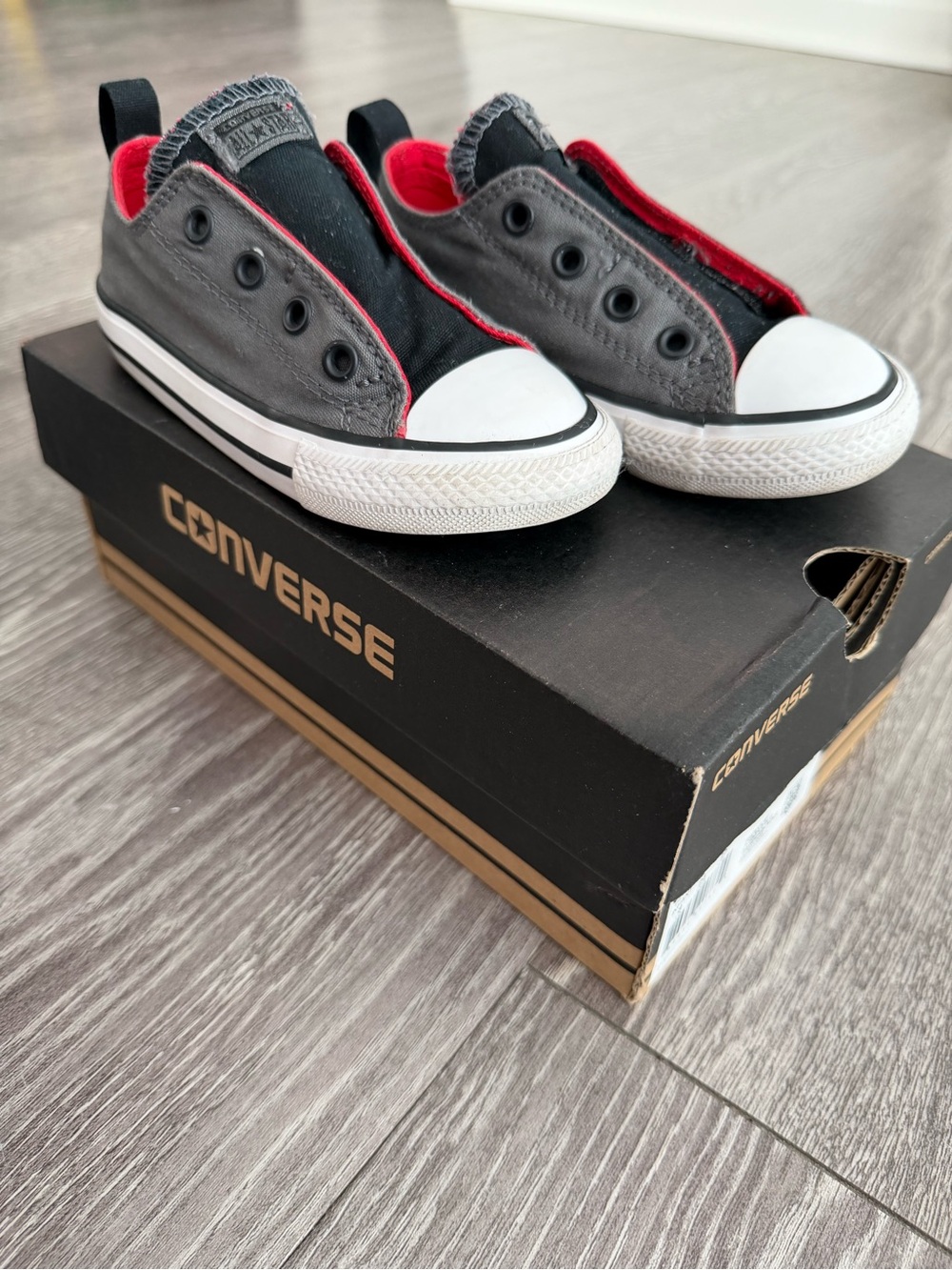 Converse Kids Slip-On Low Top Sneakers in Black and Red